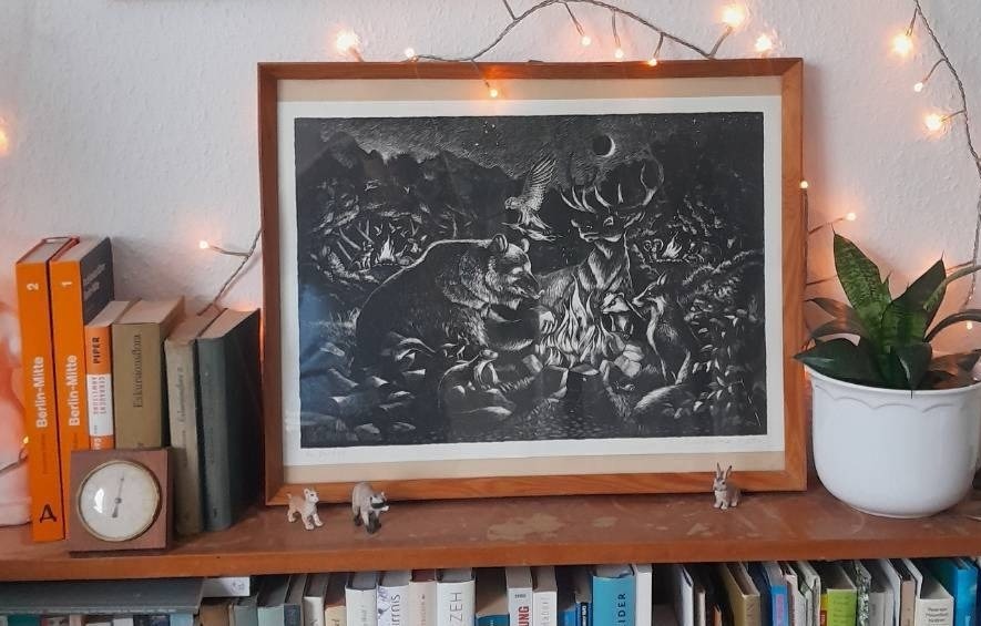 A bear, stag, fox, badger and other animals gathered around a campfire in a night forest, a hawk carrying a burning branch overhead, drawn in fine white lines on black