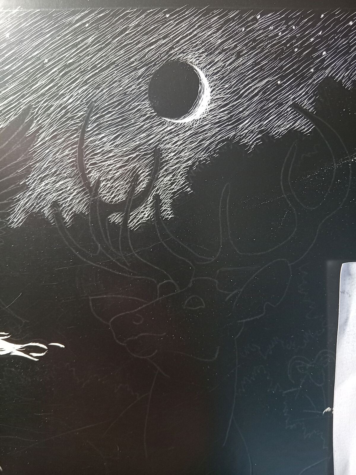 A crescent moon and hatched night sky above the unfinished outline of a stag