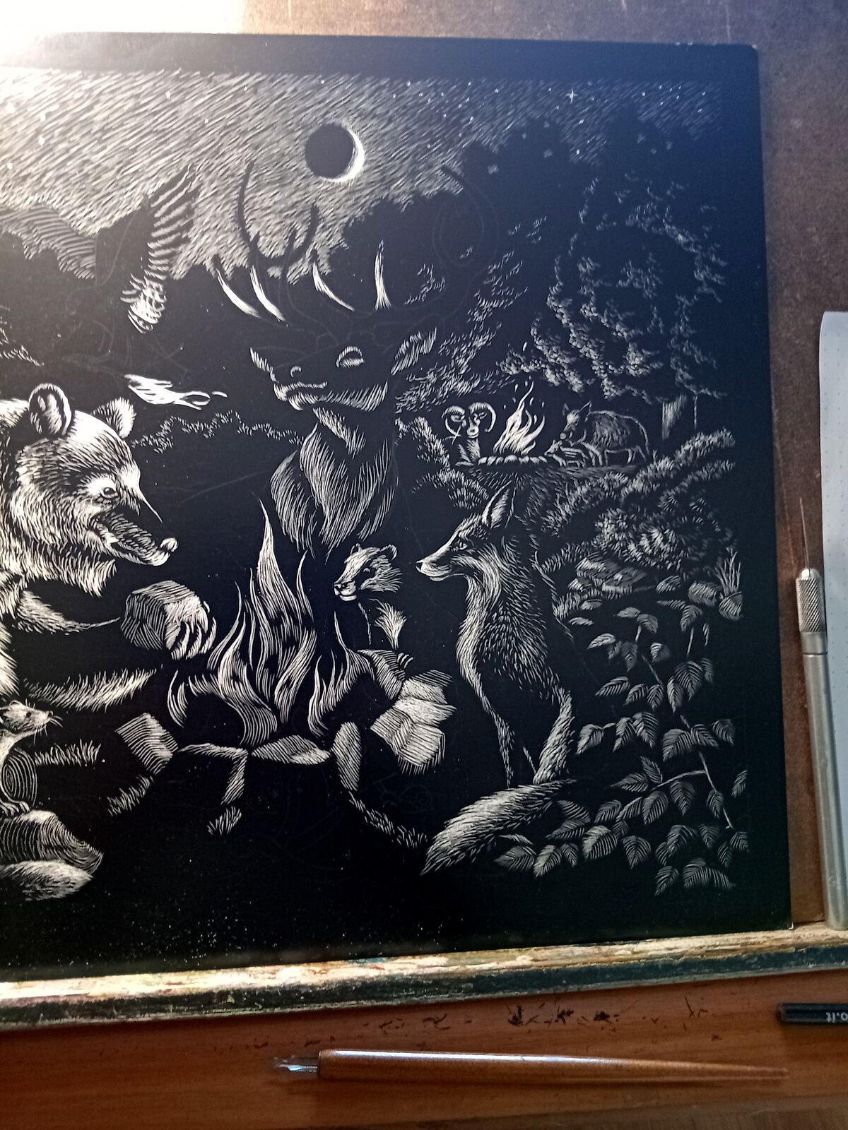 The nearly finished Bonfire artwork on the drawing board, with only small areas left to complete